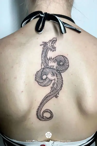 black-ink-tattoo-dragon-woman-back