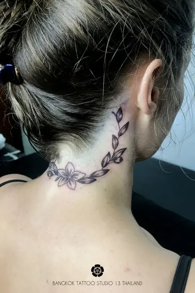 blackwork-tattoo-flowers-neck-woman