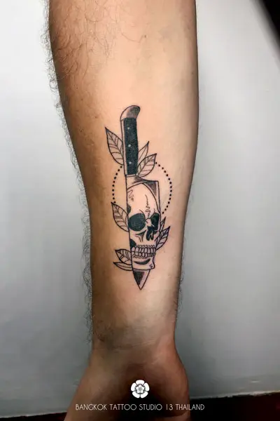 blackwork-tattoo-dagger-knife-face-skull