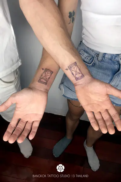 fine-line-tattoo-an-hourglass-couple-wrist