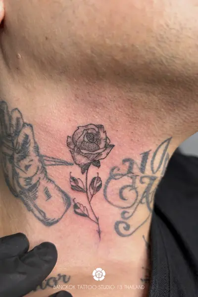 blackwork-tattoo-rose-flower-neck