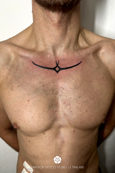nordic-black-ink-custom-tattoo-neck