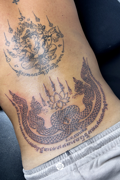 sak-yant-naga-twin-tattoo