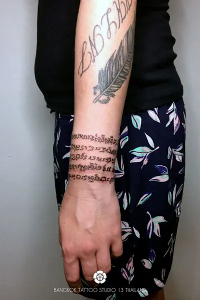 sak-yant-tattoo-in-thailand-wrist-woman