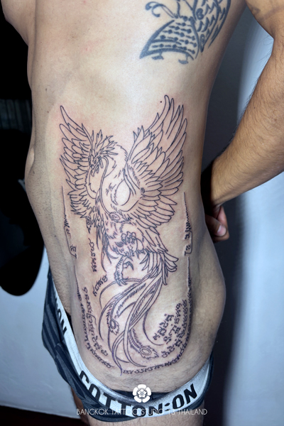 tattoo-sak-yant-feather-on-the-chest-man